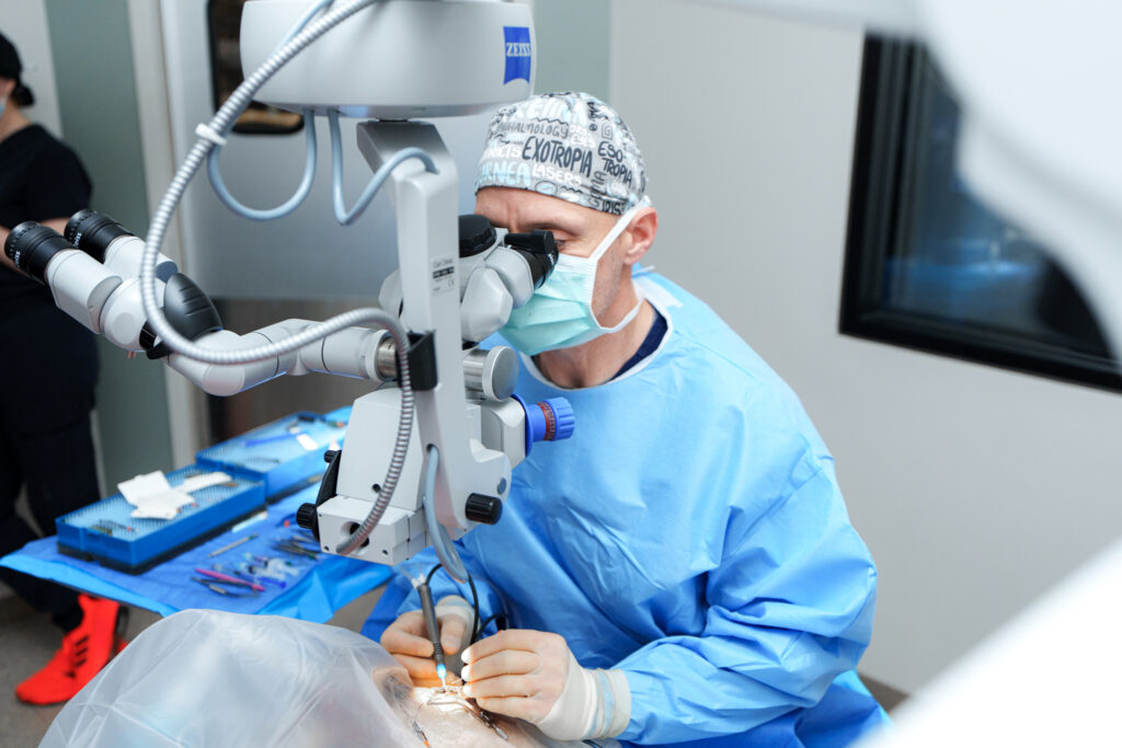 Veterinary ophthalmologist performs cataract surgery using a surgical microscope at COVE Pet Care