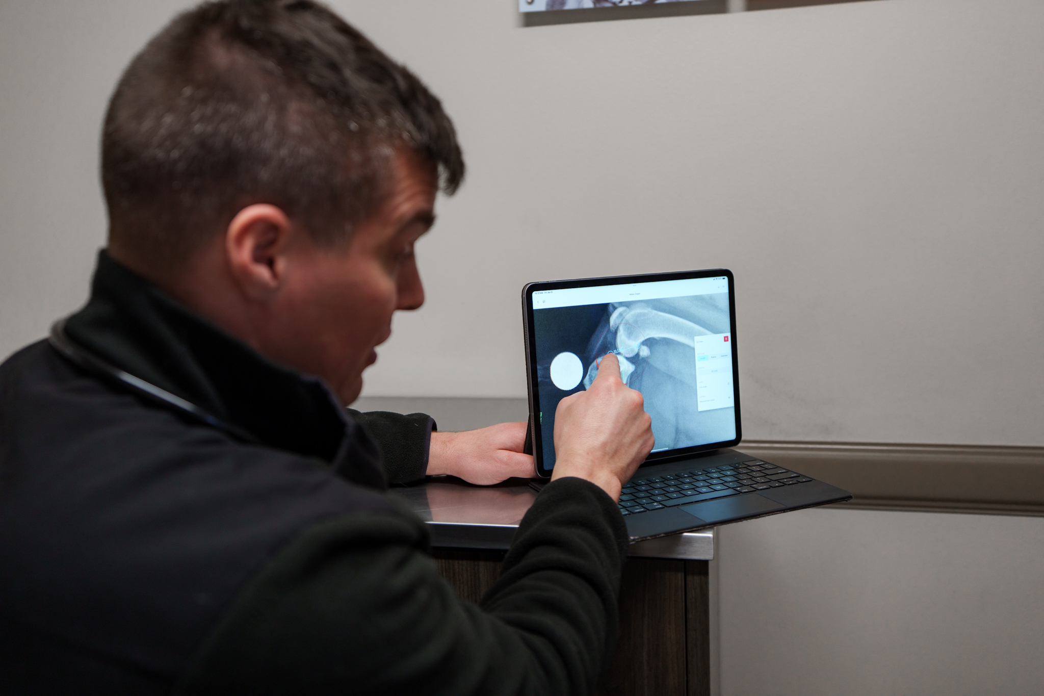 COVE veterinarian explaining a digital x-ray displayed on a tablet